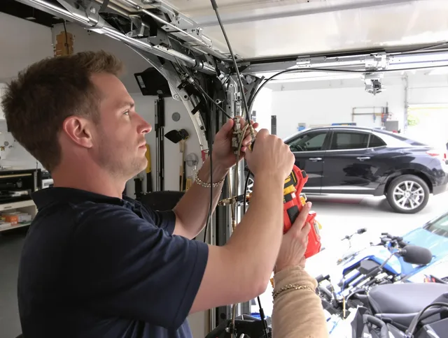 Milford city  Garage Door Repair safety certified technician performing cable replacement in Milford city 
