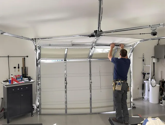 Milford city  Garage Door Repair specialist performing precise section replacement on Milford city  garage door