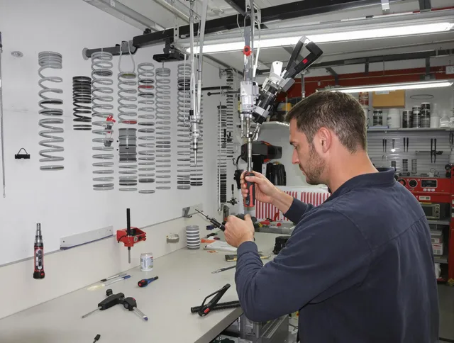 Milford city  Garage Door Repair safety certified technician performing precision spring replacement in Milford city 